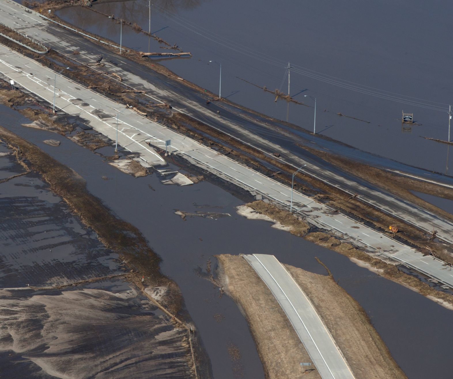 Floodwaters from the Elkhorn River have started to recede, exposing a heavily damaged West Dodge Road.